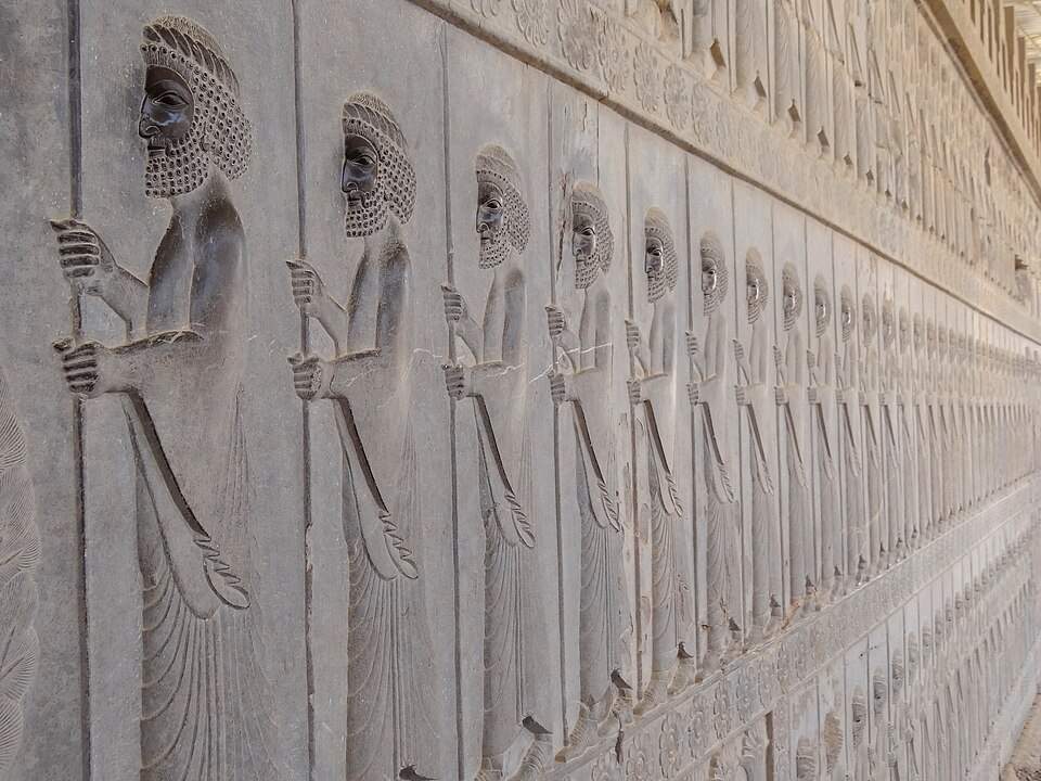Bas-relief carvings on the Apadana Staircase at Persepolis depicting tribute-bearing delegations