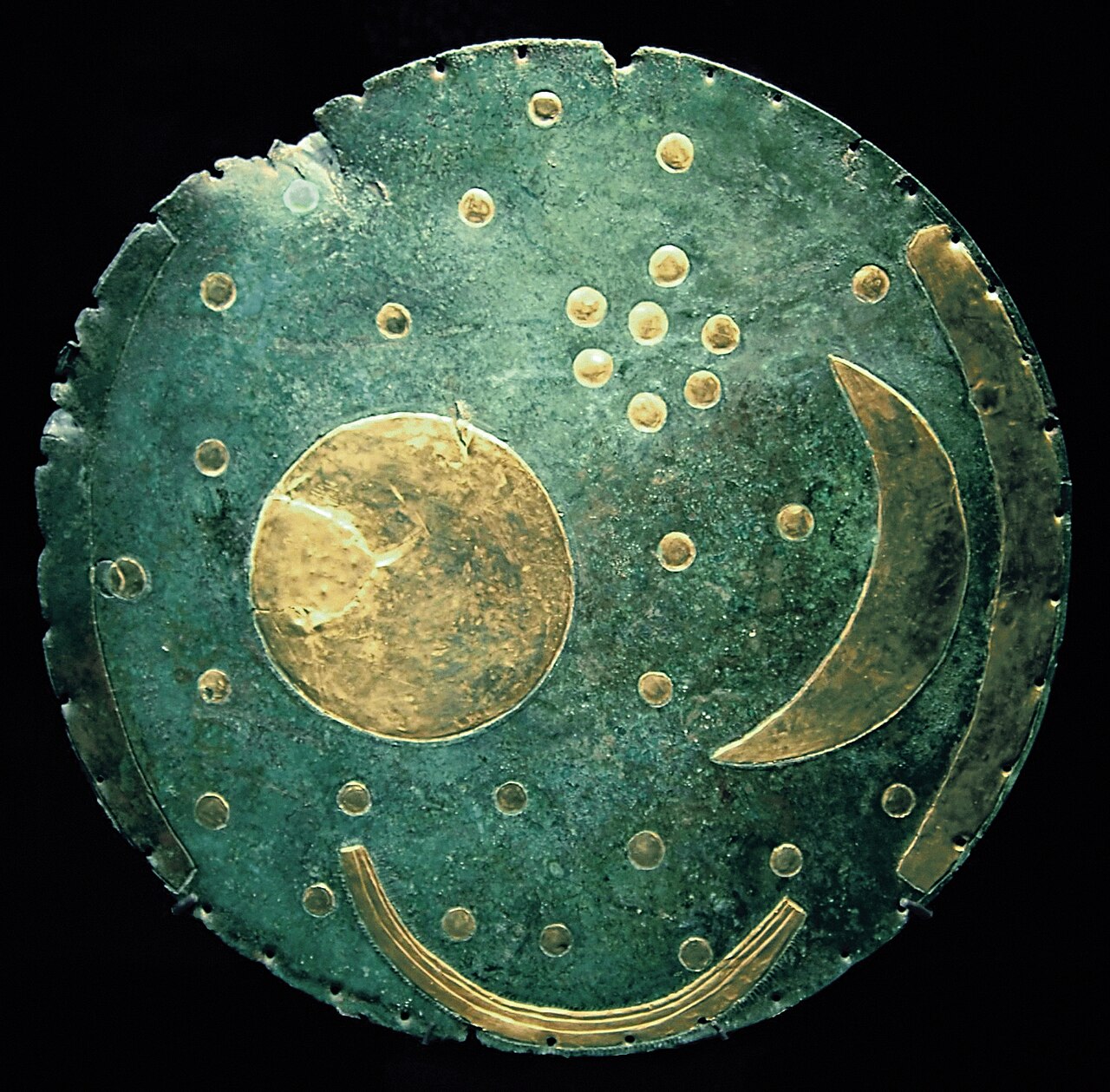 The Nebra sky disk, a bronze disk with gold celestial symbols including the sun, moon, and stars