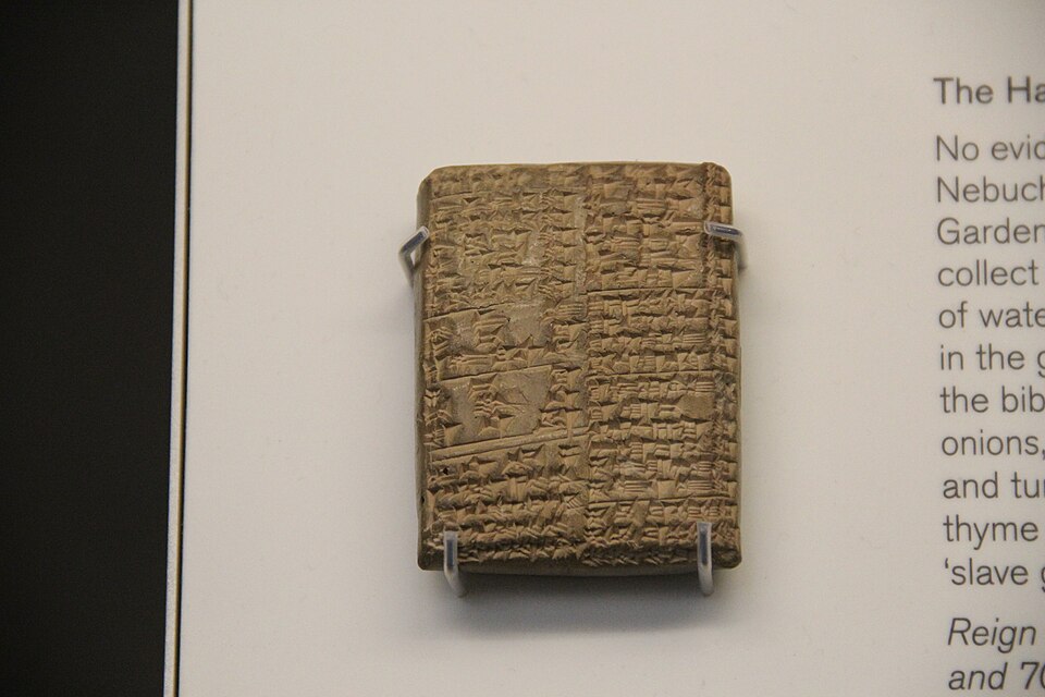 A clay tablet bearing cuneiform script from ancient Mesopotamia, on display at the British Museum
