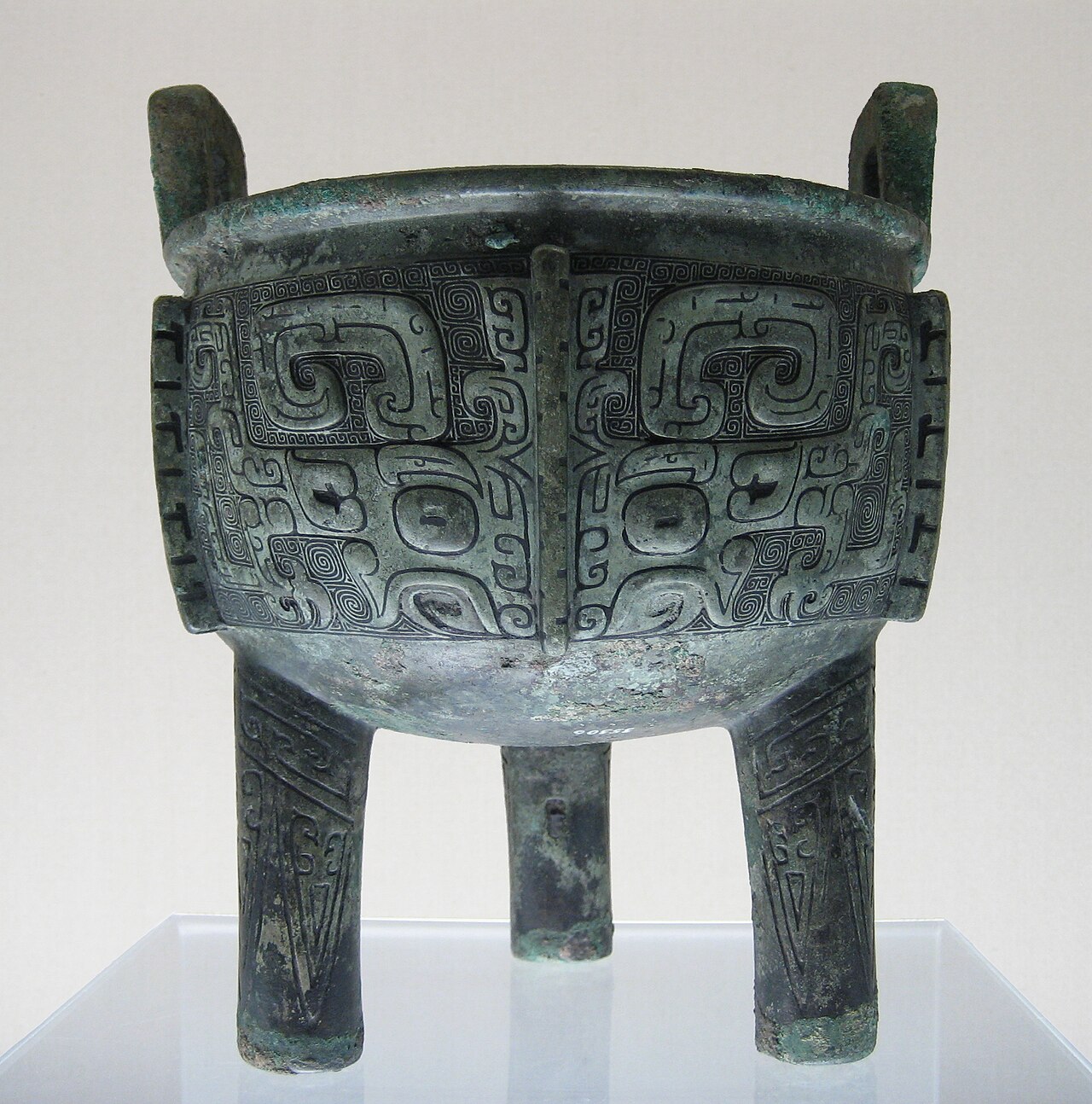 A Chinese bronze ritual vessel from the Shang dynasty with elaborate decorative patterns