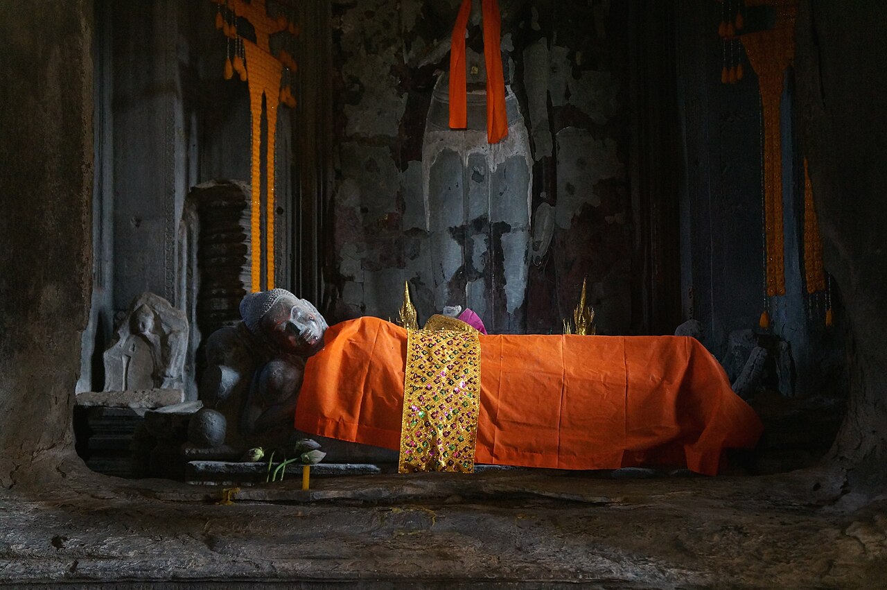The iconic towers of Angkor Wat reflected in a water pool, Cambodia
