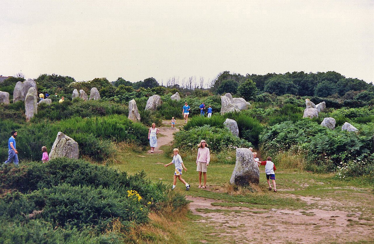 Rows of ancient standing stones at Carnac, Brittany, stretching into the distance