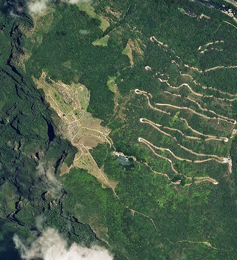 Aerial view of Machu Picchu on its mountain ridge above the Urubamba River gorge
