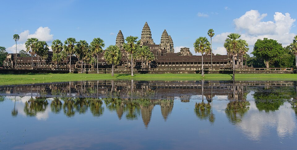 Angkor Wat temple complex reflected in the surrounding moat at dawn