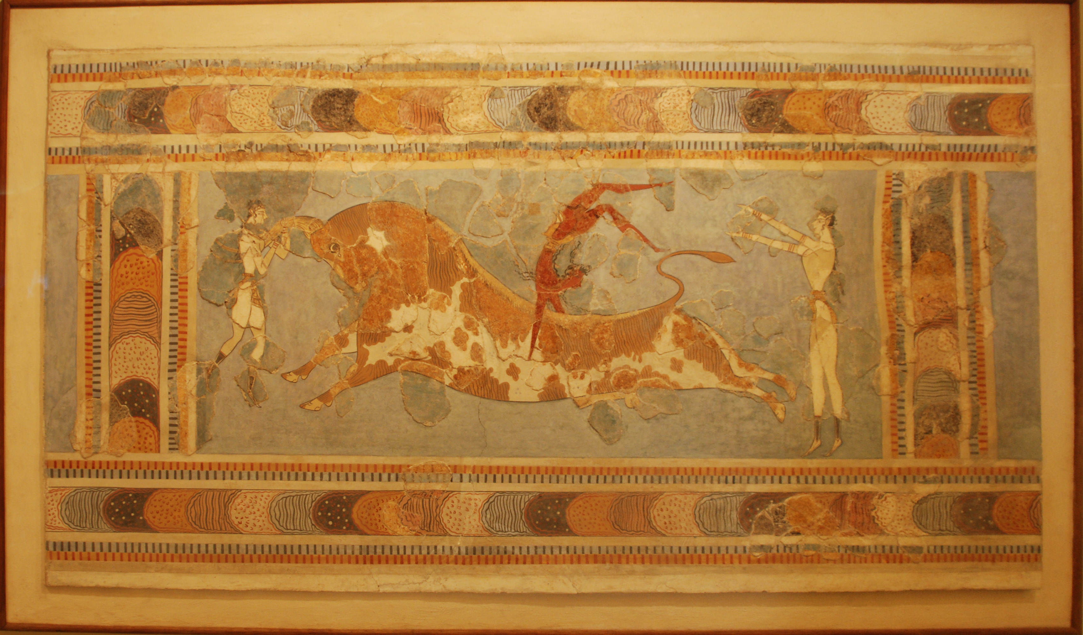 Bull-leaping fresco from the Palace of Knossos, Crete, showing acrobats vaulting over a bull