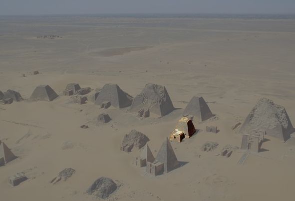 A group of steep-sided pyramids at the ancient Nubian site of Meroe in Sudan