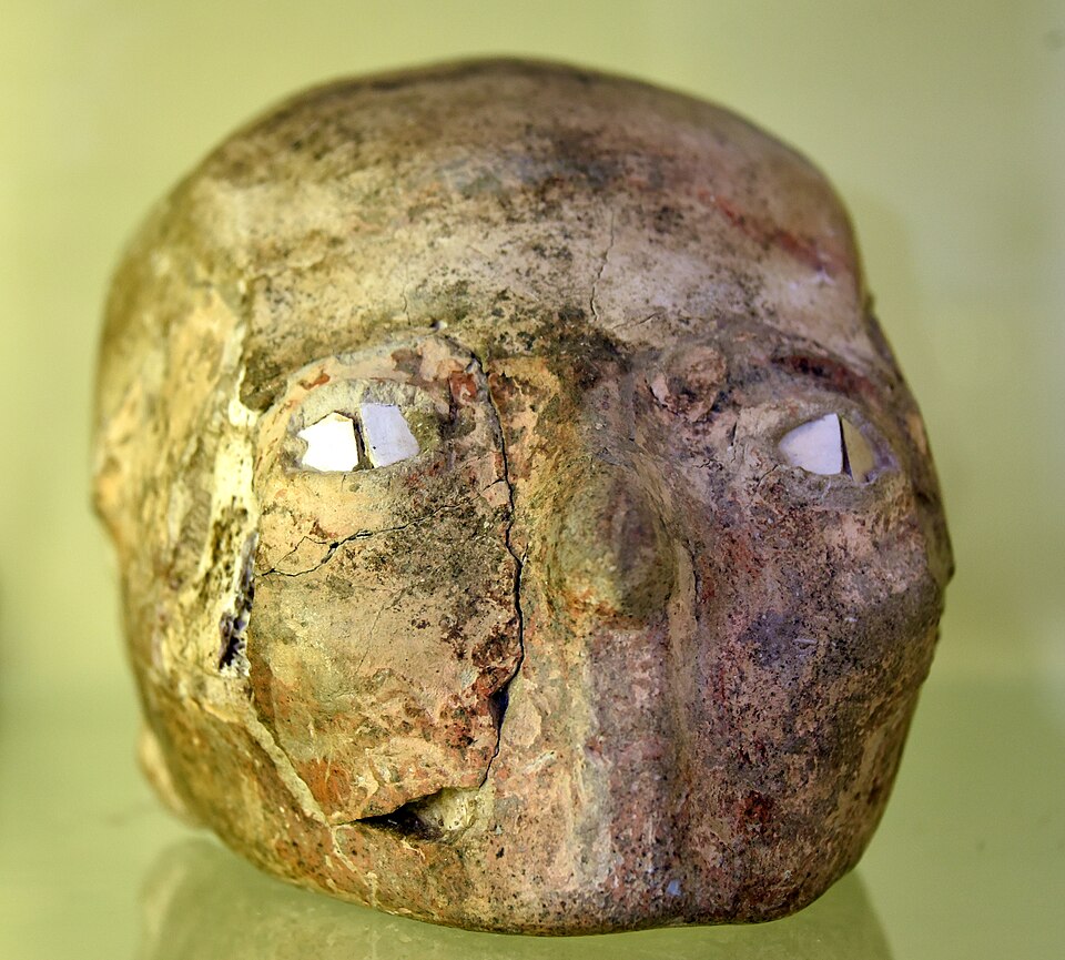 A Pre-Pottery Neolithic B plastered skull from Jericho, West Bank, c. 8200–7500 BCE, with plaster features and shell eyes, Jordan Archaeological Museum