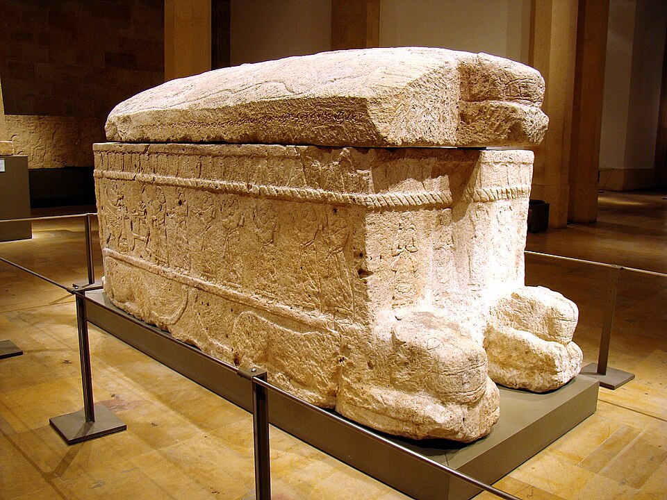 The sarcophagus of Ahiram, king of Byblos, carved with Phoenician relief scenes and bearing the earliest long Phoenician inscription