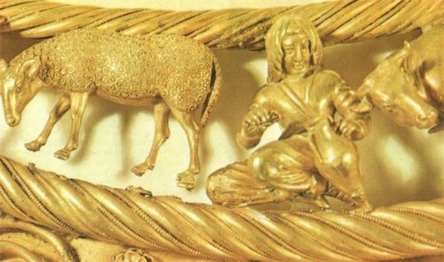 An elaborate gold pectoral ornament from a Scythian royal burial showing detailed animal and human figures