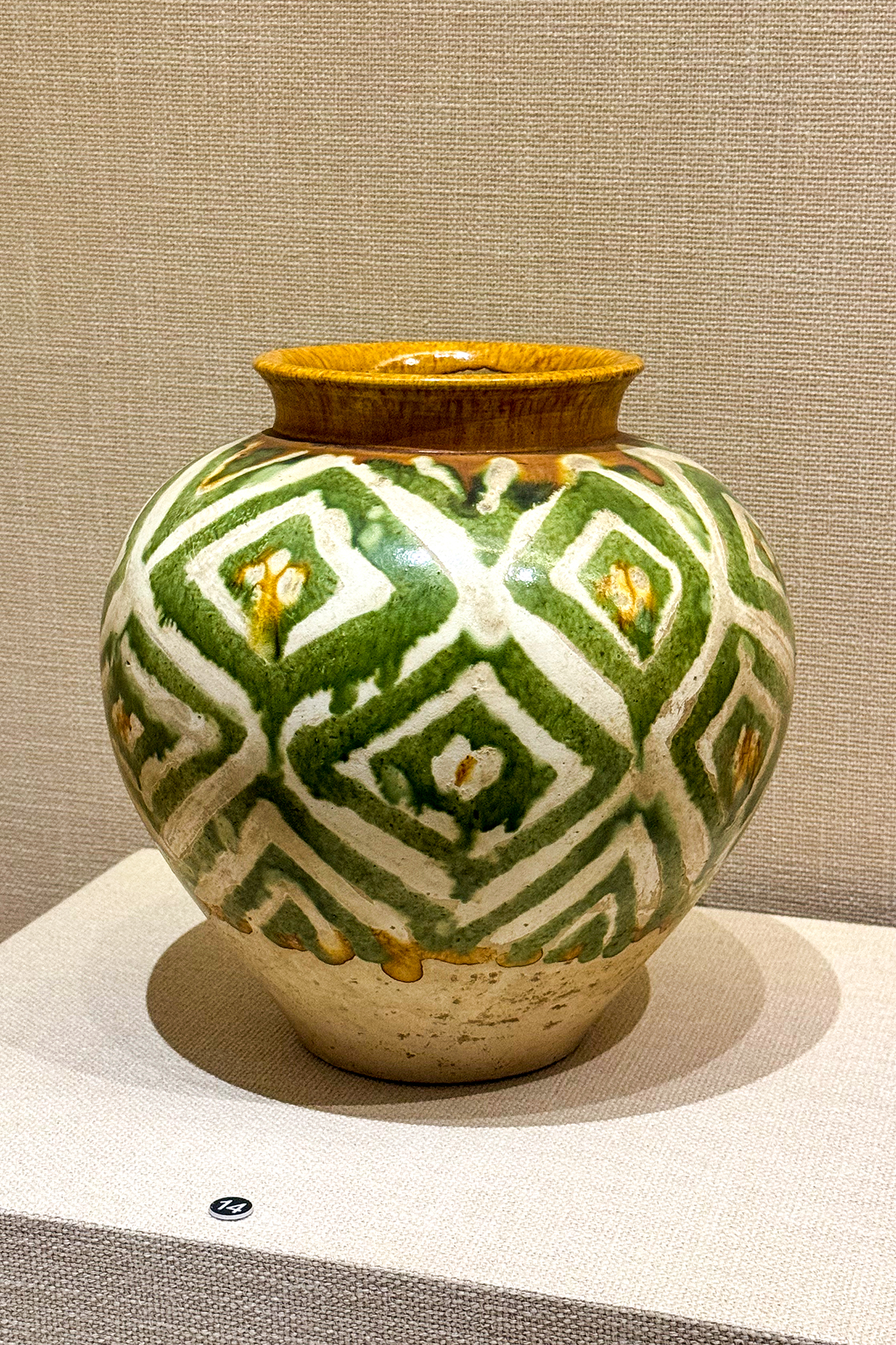 A Tang dynasty three-colour glazed ceramic horse figurine