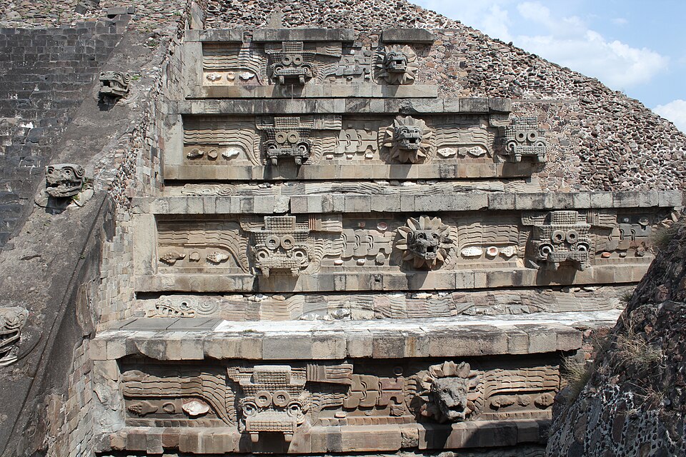 Carved stone heads of feathered serpents on the facade of the Temple of the Feathered Serpent at Teotihuacán