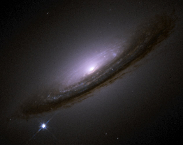 Supernova 1994D blazing at the lower left of galaxy NGC 4526