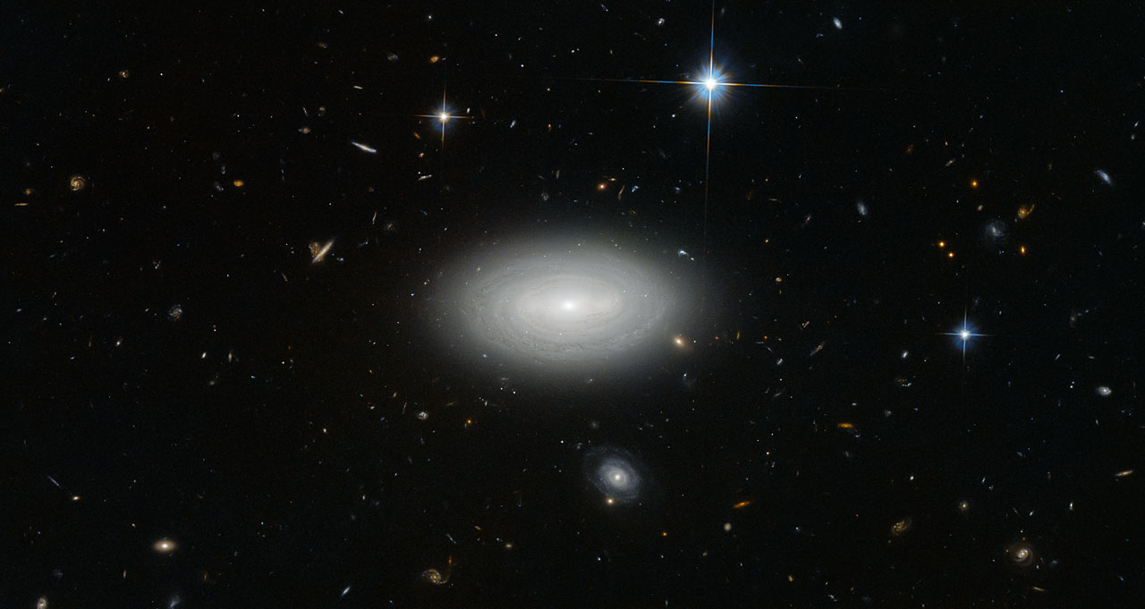 Hubble Space Telescope image of a sparse field of distant galaxies, illustrating the vast emptiness of cosmic voids