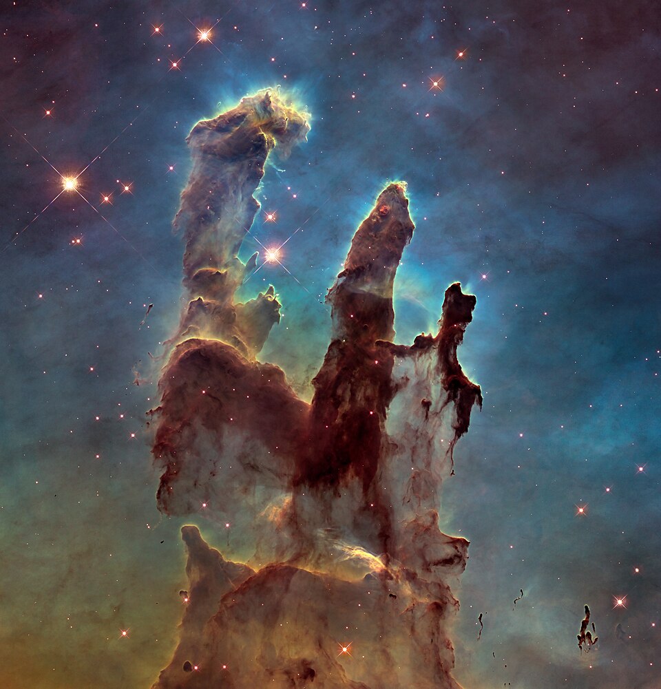 The Pillars of Creation in the Eagle Nebula, columns of gas and dust in an H II region