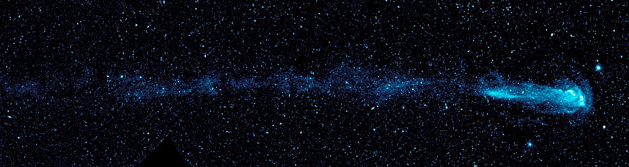 Mira A is a red giant variable star in the constellation Cetus.  This ultraviolet-wavelength image mosaic, taken by NASA's GALEX, shows a comet-like "