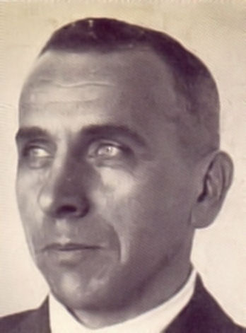 A black and white photograph of Alfred Wegener, the originator of the continental drift hypothesis