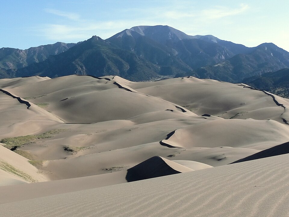 Aeolian sand dunes at Great Sand Dunes National Park in Colorado with the Sangre de Cristo Mountains in the background