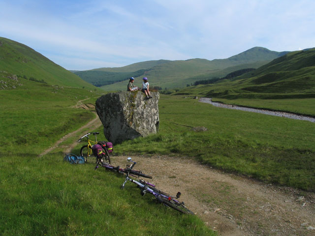 Large glacial erratic boulder resting on a hillside in Gleann Taitneach, Scotland