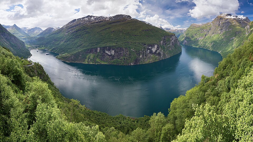 Geirangerfjord in Norway viewed from Ornesvingen, showing the steep U-shaped walls carved by a Pleistocene glacier