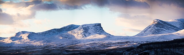 Lapporten, a classic U-shaped glacial valley in northern Sweden, with steep walls and a broad flat floor