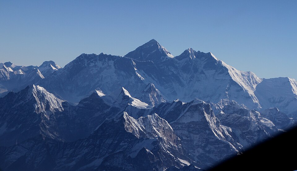 Aerial view of the Himalayan peaks including Nuptse, Everest, and Lhotse from a flight out of Kathmandu