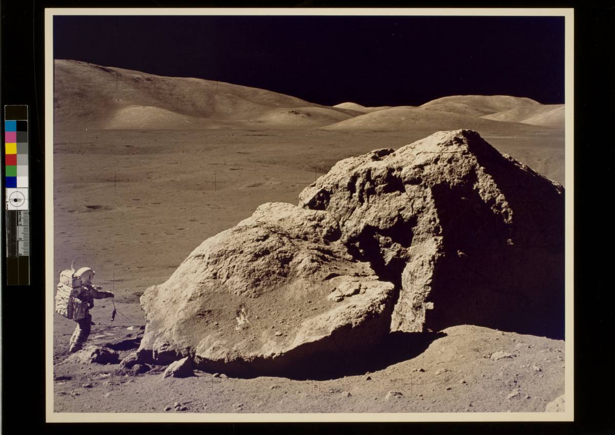Apollo 17 astronaut Harrison Schmitt collecting lunar rock samples at Taurus-Littrow valley on the Moon in December 1972
