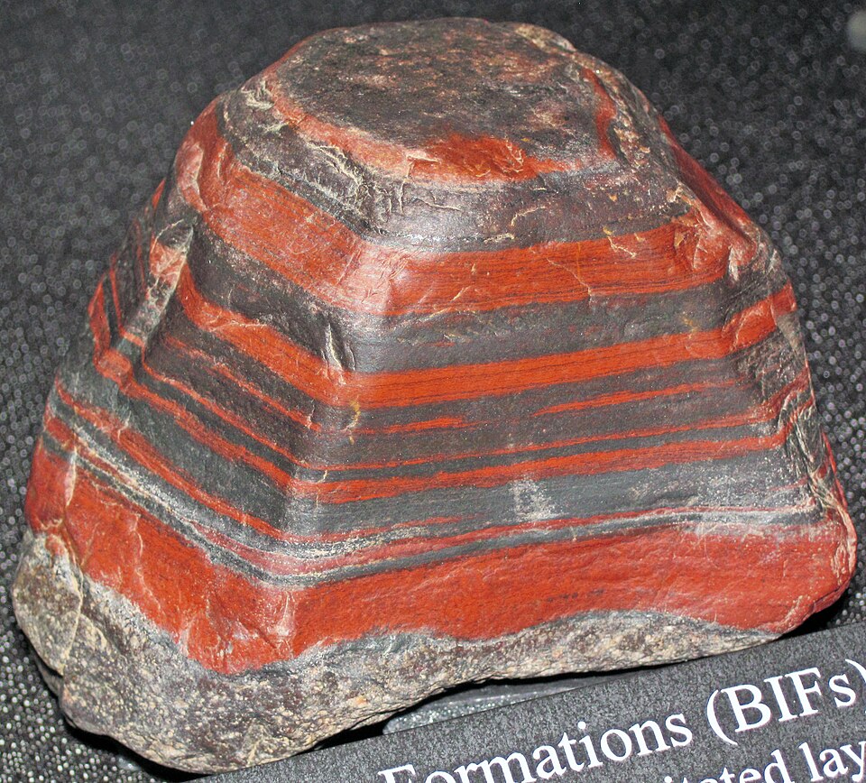 Jaspilite banded iron formation specimen showing alternating red jasper and silvery iron oxide layers