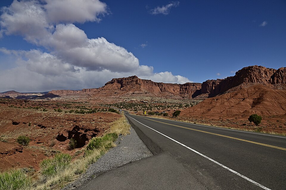 Exposed sedimentary strata in Capitol Reef National Park, Utah, showing nearly 10,000 feet of layered rock spanning Permian to Cretaceous age