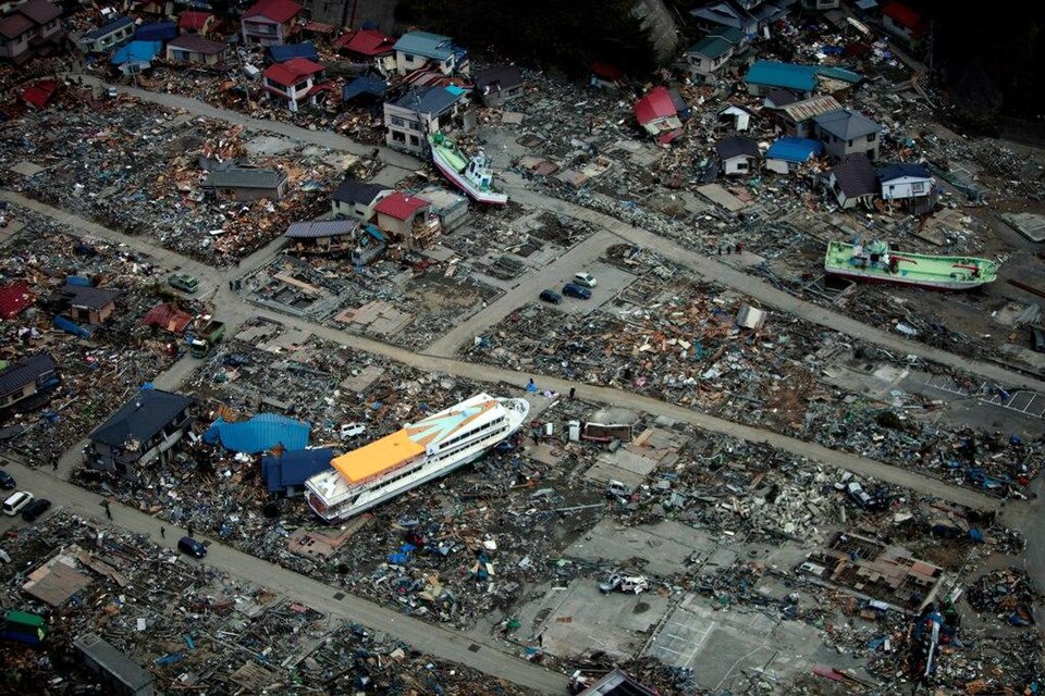 Aerial view of a large ferry boat resting inland among destroyed houses in Miyako, Japan after the 2011 Tohoku tsunami