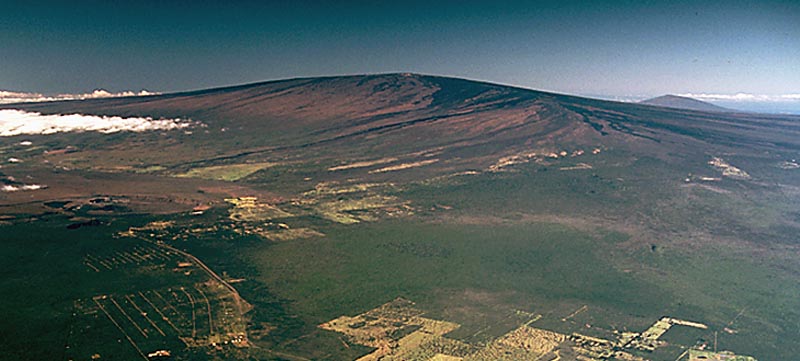 Aerial view of Mauna Loa volcano, Hawaii, showing the broad shield profile built by successive basaltic lava flows