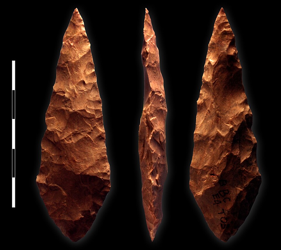 A bifacial silcrete point from the M1 phase (c. 71,000 BCE) of Blombos Cave, South Africa, representing the Still Bay lithic industry