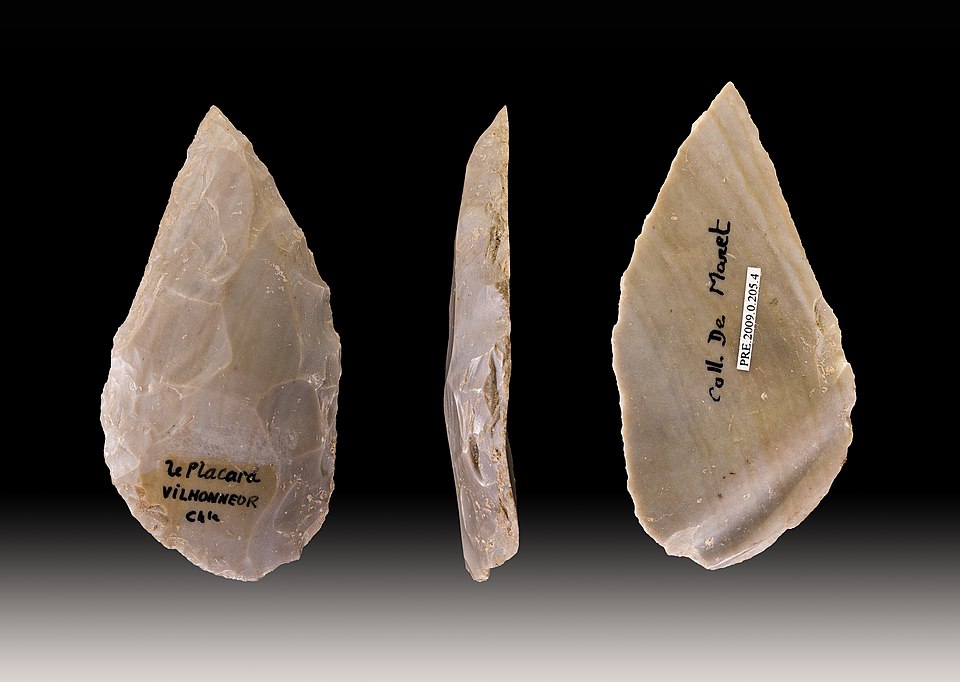 A Mousterian flint point from Grotte du Placard, Charente, France, dated to the Middle Paleolithic.