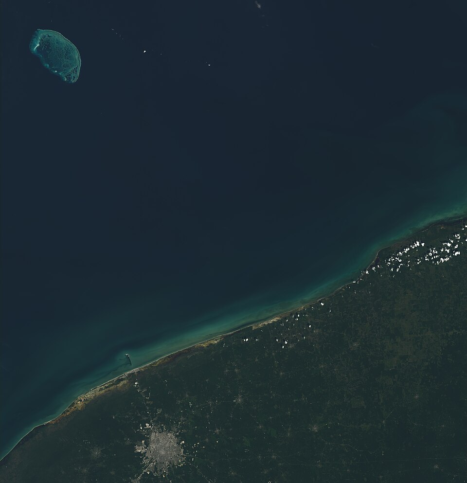 Satellite image of the Yucatan Peninsula showing the semicircular outline of the Chicxulub impact crater