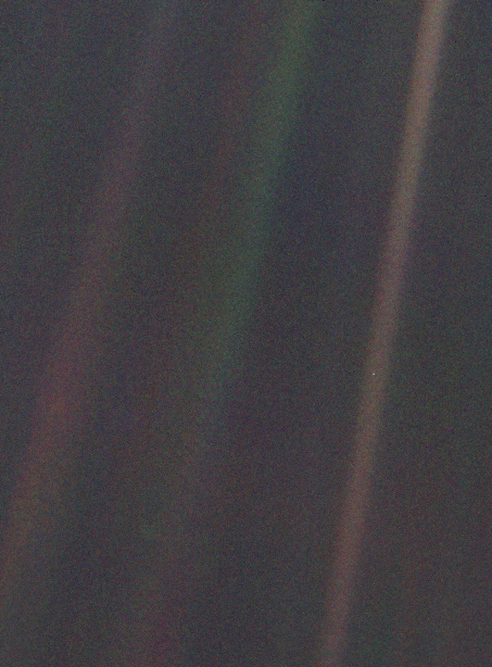 The Pale Blue Dot photograph taken by Voyager 1, showing Earth as a tiny speck in a beam of sunlight