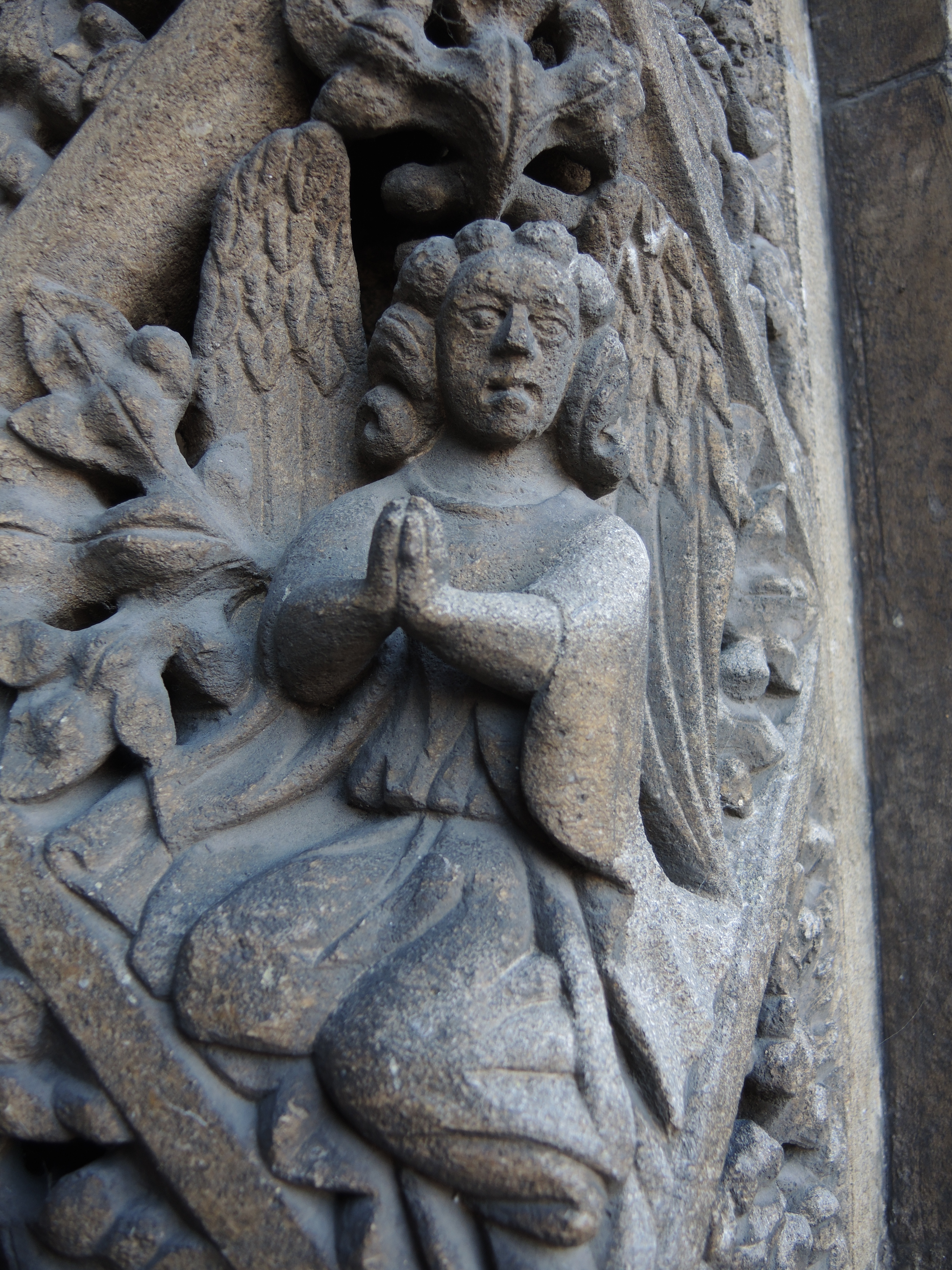 Sculpture of hands clasped in prayer